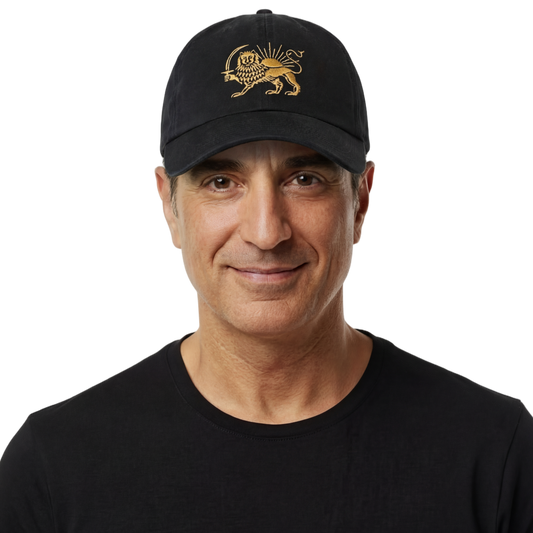 Man wearing a black cap with a gold emblem and a black t-shirt on a white background